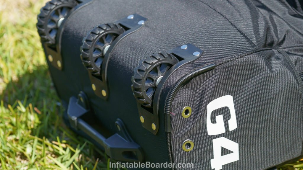 The bottom of the G4 backpack has three heavy duty wheels and a hard handle.