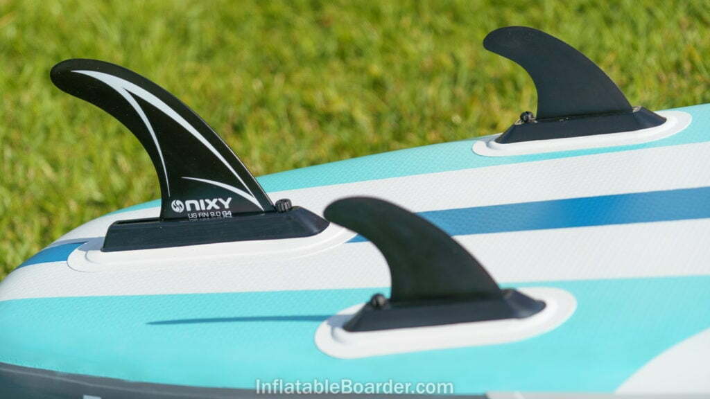 Large main fin and two smaller side fins at the back of the board.
