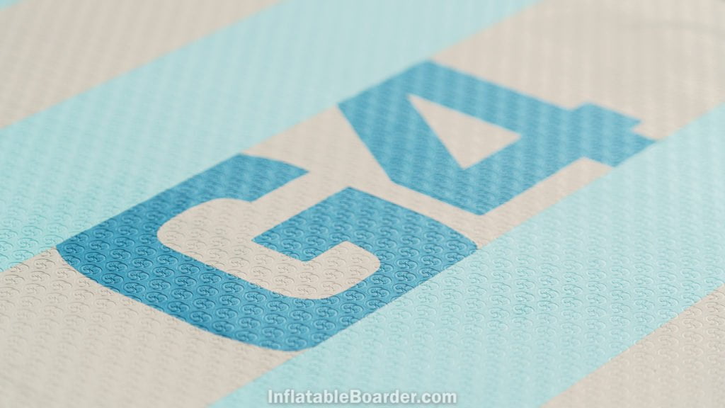 Detail of the broad, flat deck foam with the G4 brand and stamped NIXY logo for grip