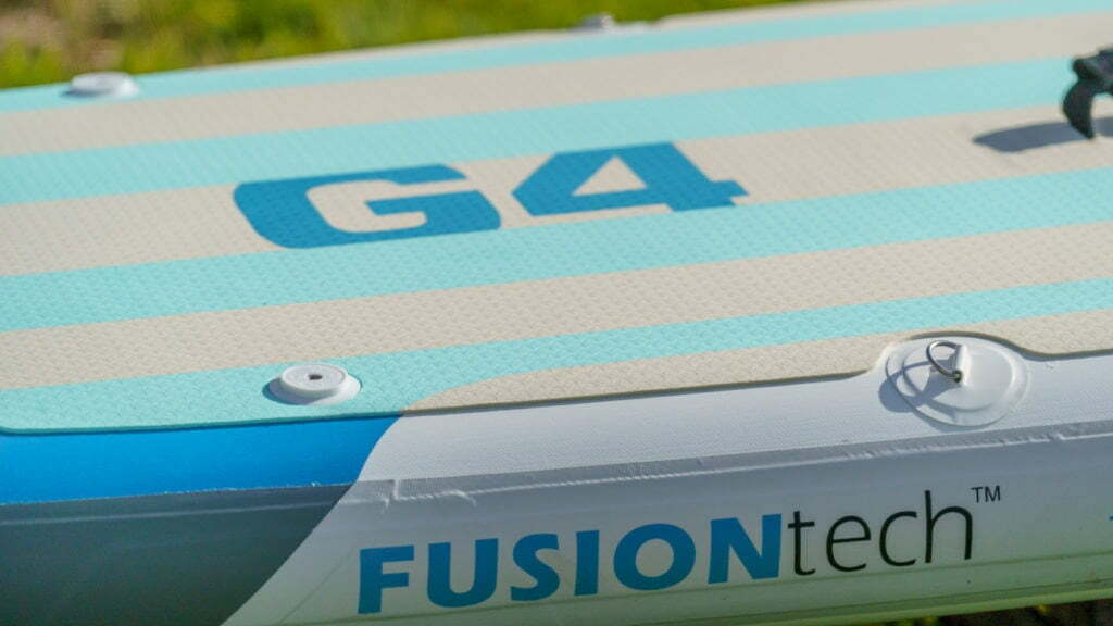 Side of the G4 board featuring FusionTech construction branding, action mounts, and d-rings.