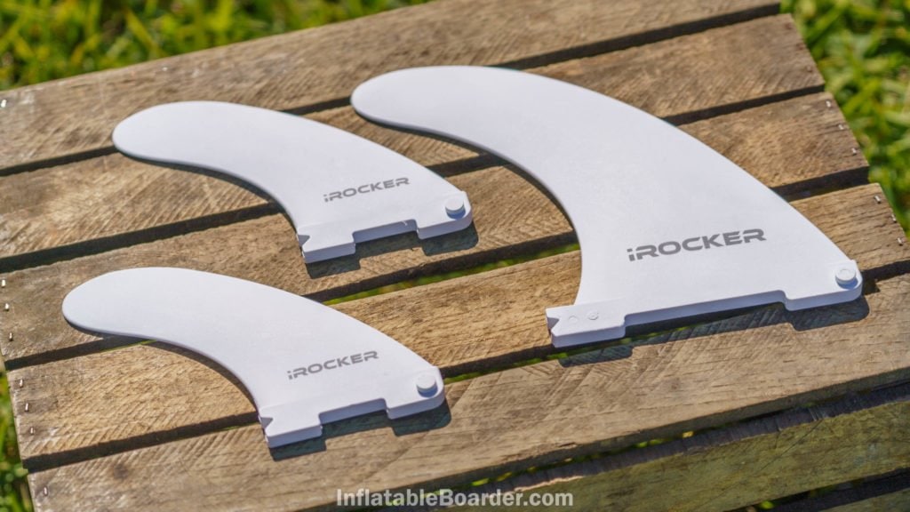The one large and two small quick-attach fins are white with the iROCKER logo.