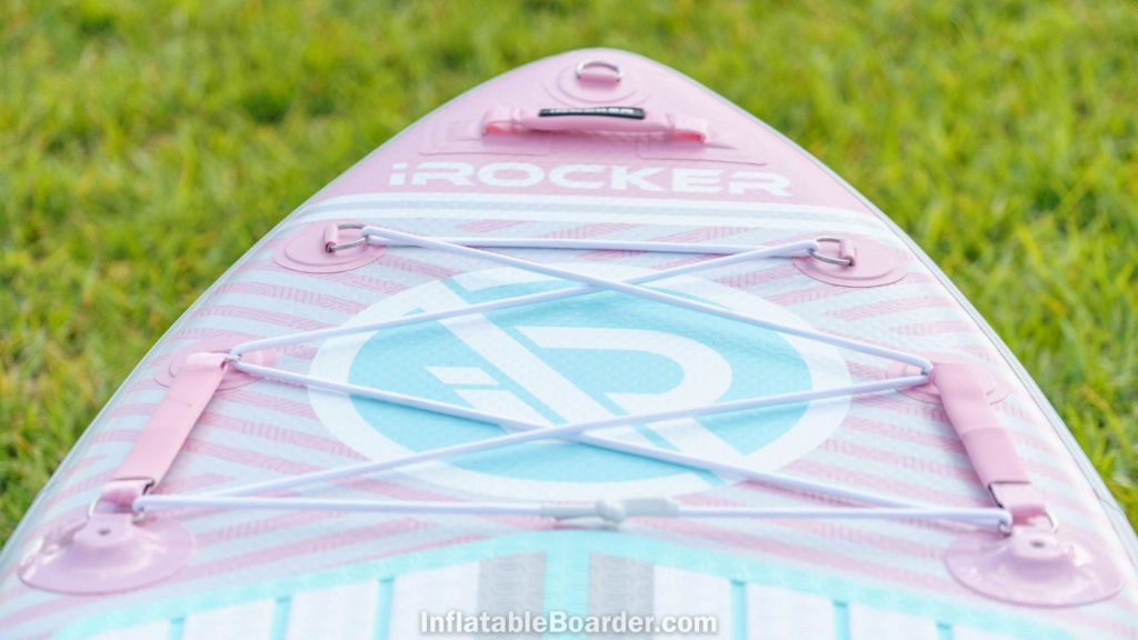 Detail of the front of the pink board with nose d-ring, padded handle, large bungie cargo area, and child handles.