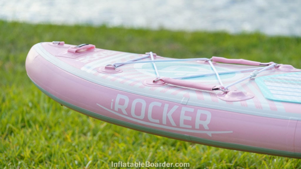 Nose of the pink board with iROCKER logos, handle, cargo area, action mounts, and d-ring.