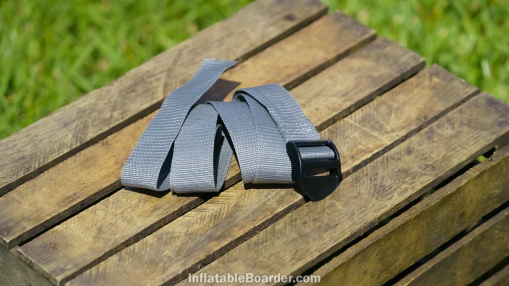 A gray nylon compression strap is included for the SUP.