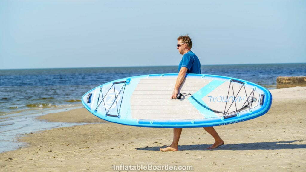 Carrying the 10'6" from beach to ocean.