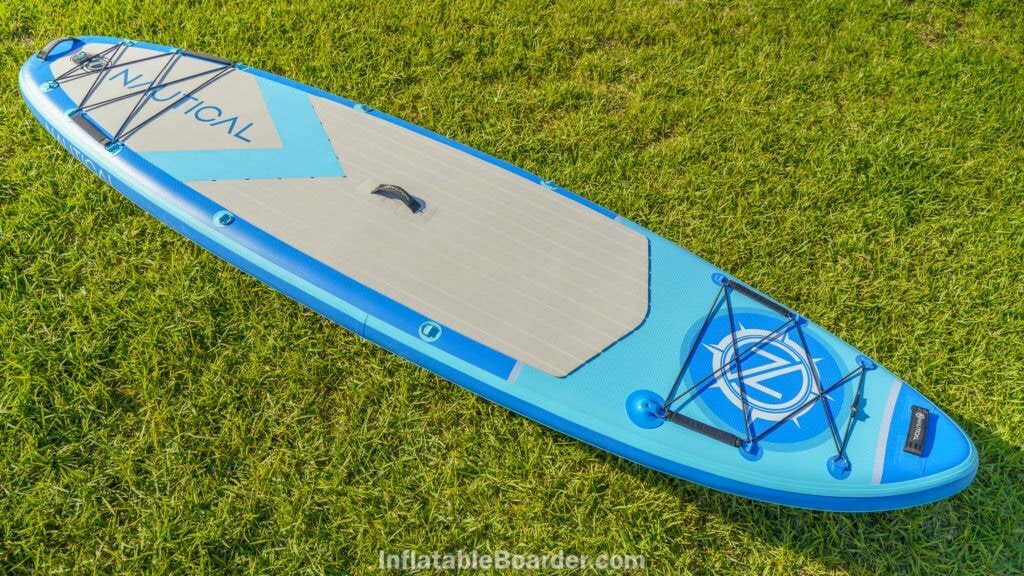 2021NAUTICAL 10'6" paddle board top overview, featuring two large bungie cargo areas, three handles, front and rear child handles, 1 action mount, 4 center d-rings, and deeply grooved deck texture.