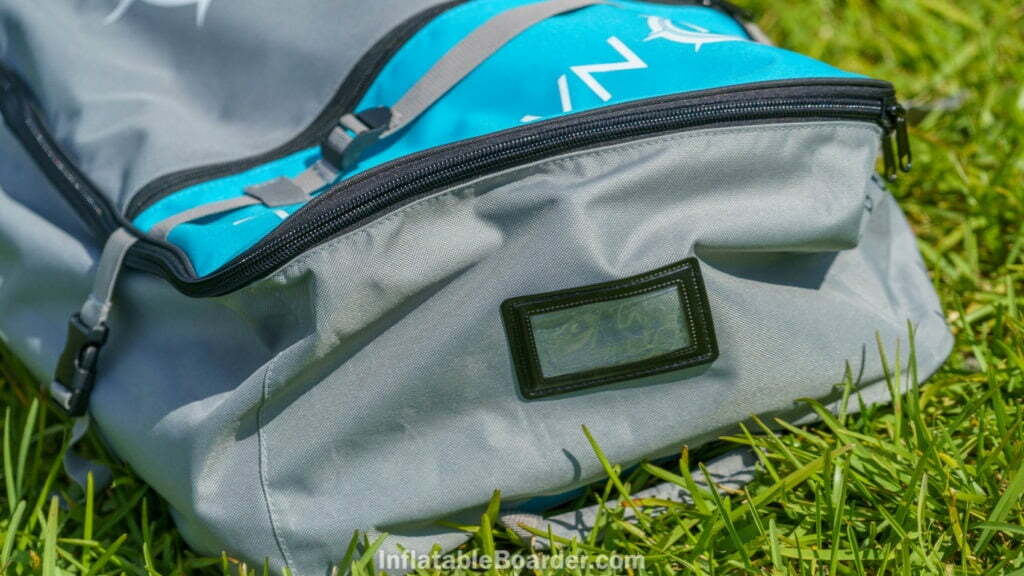The top of the bag has a clear luggage tag window.
