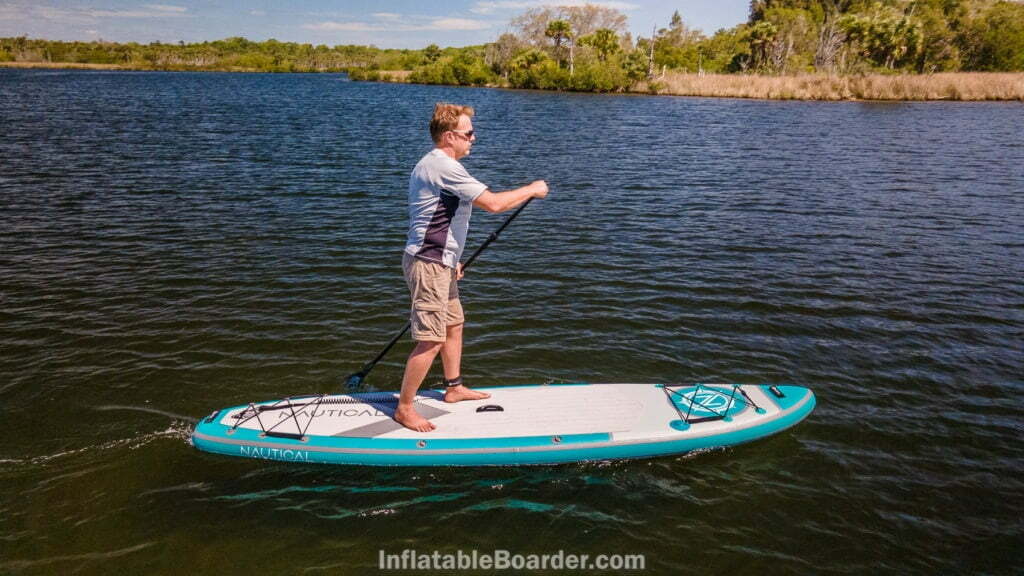 Side view of paddling the board.