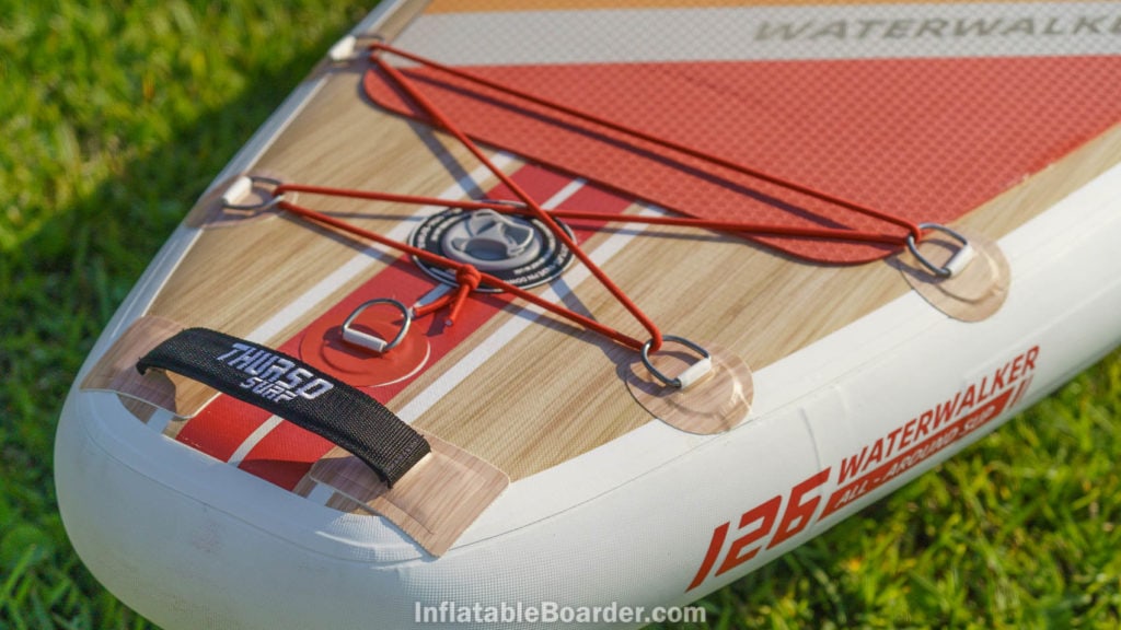 Rear of the board with detail of the padded handle and leash attachment d-ring.