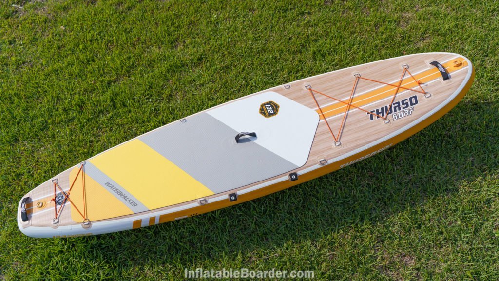 Top view of the Waterwalker 132, featuring two cargo areas, 3 padded handles, 1 action mount, a side paddle holder, and 4 d-rings at the middle of the board.