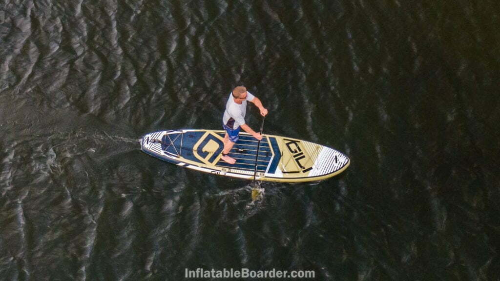 Above view of paddling the board on an ocean.