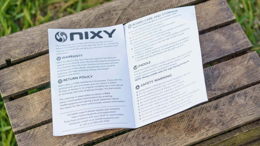 The NIXY manual and warranty documentation.